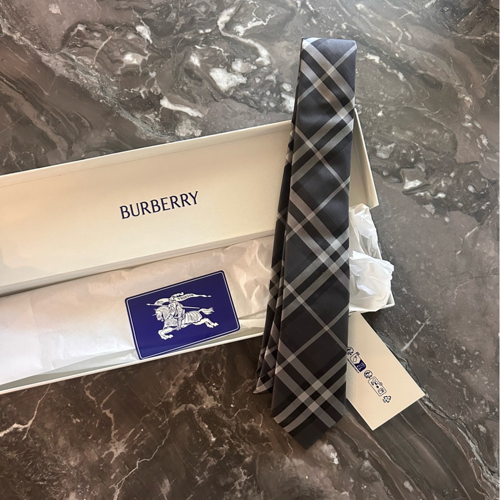 Brand new in box and wrapping paper Burberry Charcoal Tie with tags.